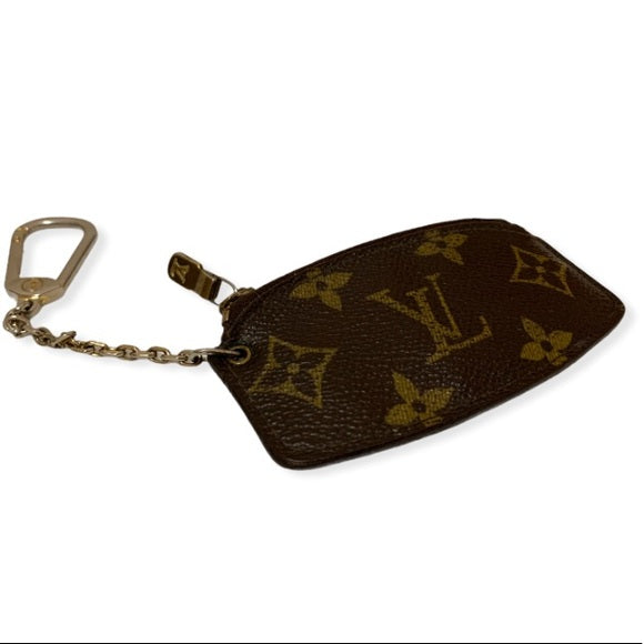 Louis vuitton coin purse with key chain .