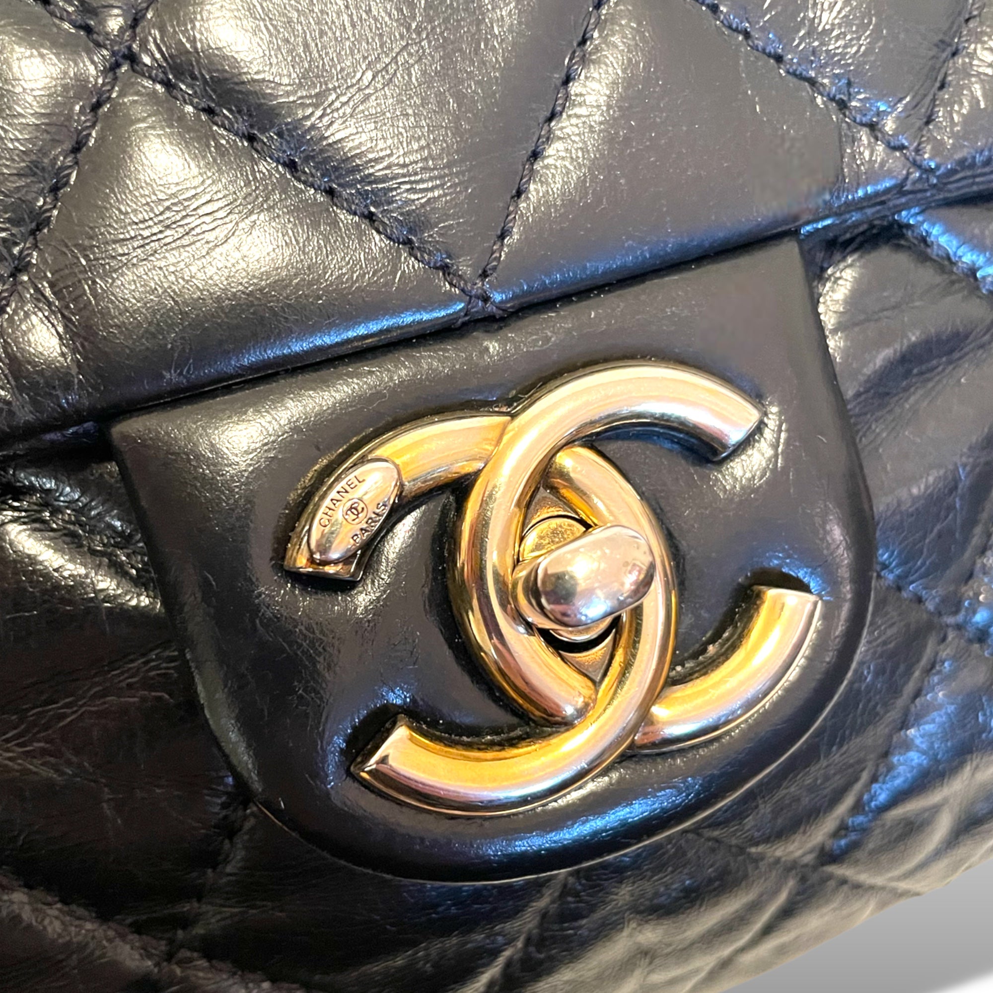CHANEL Glazed Calfskin Castle Rock Black & Antiqued Gold-Tone Hardware Flap Bag