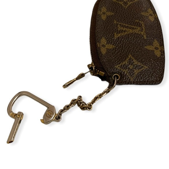 Louis vuitton coin purse with key chain .